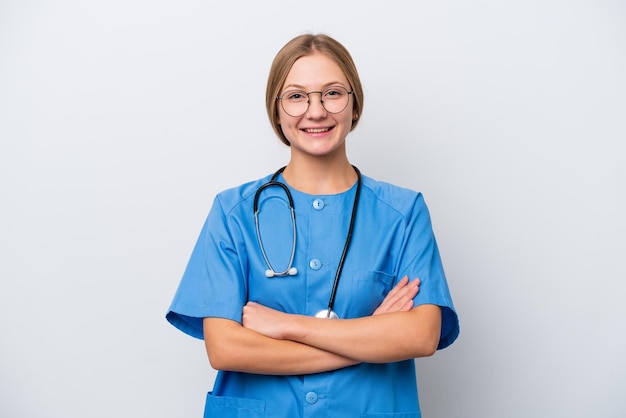 Young nurse doctor woman isolated on white background keeping the arms crossed in frontal position