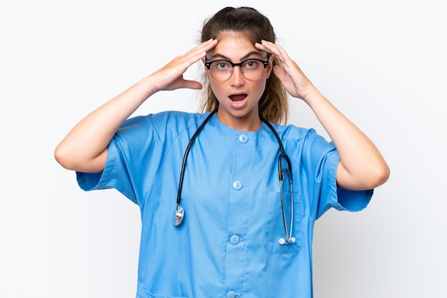 Young nurse doctor woman isolated on white background with surprise expression