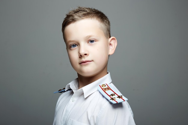 Young officer handsome boy weared in uniform Police child