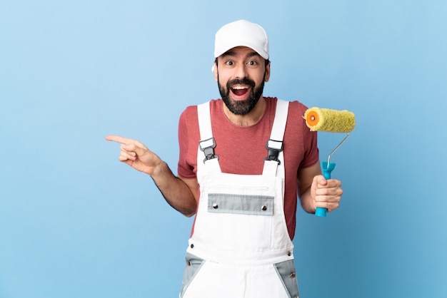 Young painter man over isolated background