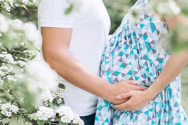 Young parents in the park on a warm spring day