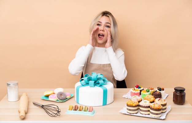 Young pastry woman over isolated wall