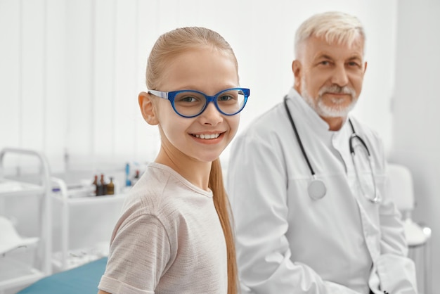 Young patient and eldery doctor on couch