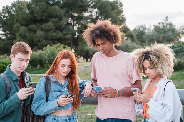 Photo young people abusing the use of screens with their smartphones concept addiction vice