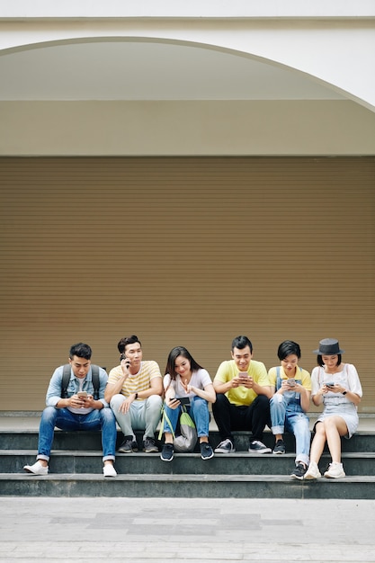 Photo young people checking social media