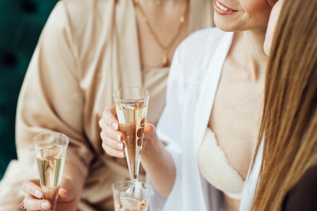 Young people in club or bar drinking cocktails and having fun