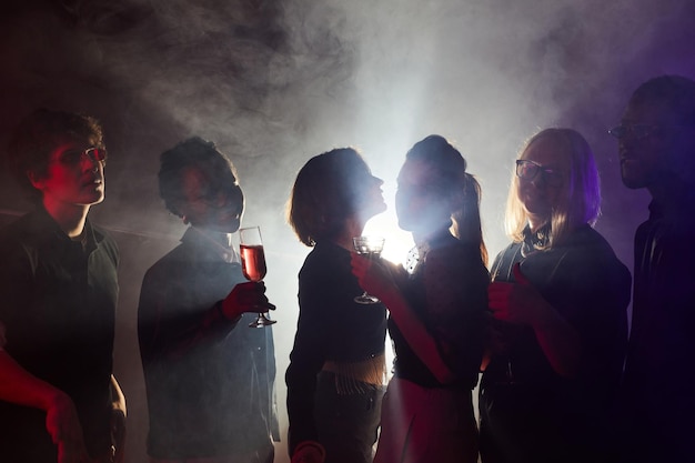 Young People Dancing in Smoke