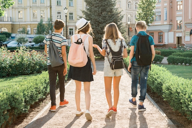 Young people friends walking in the city