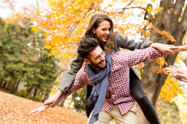 Young people having fun in the autumn park