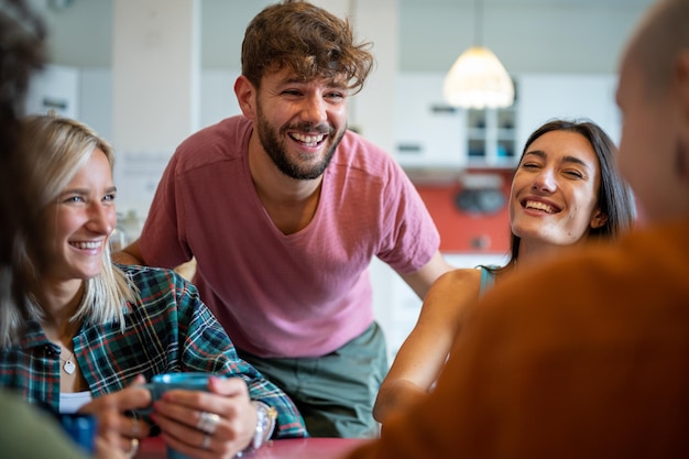 Young people having fun in hostel living room young travelers lifestyle