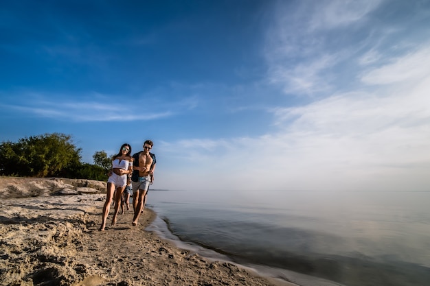 The young people jogging at the beach