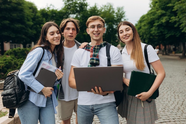 Young people looking at laptop together