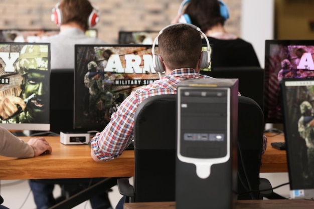 Young people playing video games at tournament