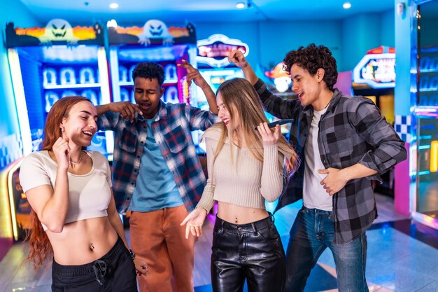 young people singing karaoke and having fun in an arcade