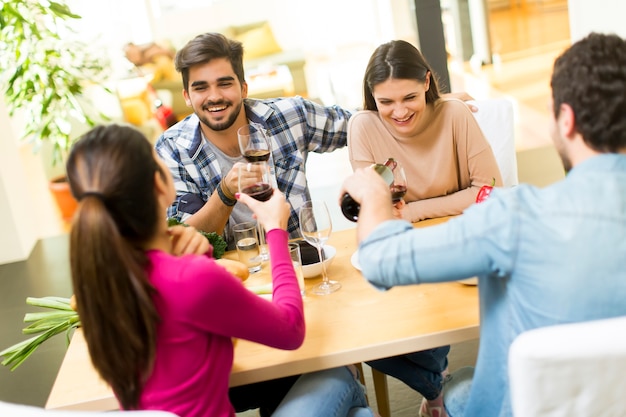 Young people sitting by the table