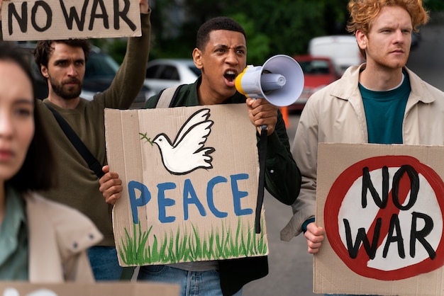 Photo young people taking part of anti war protest