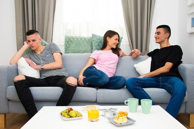 young people talking in living room , fun and bored concept with different emotions