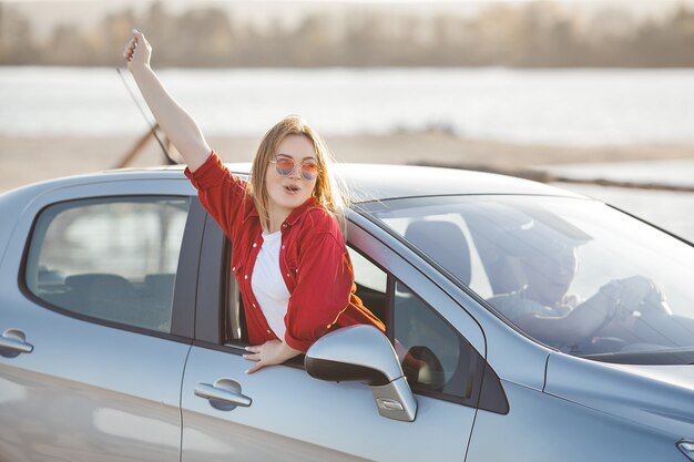 Young people traveling by car. Couple having an automobile trip.