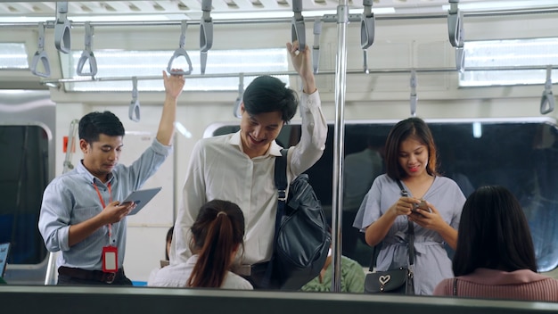 Young people using mobile phone in subway