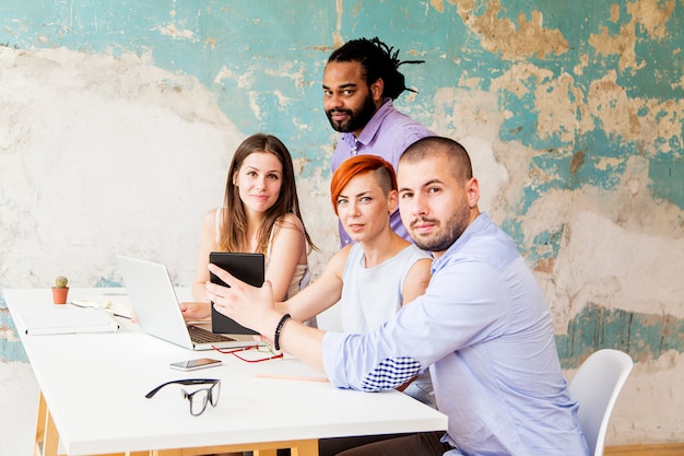 Young people working in the grunge office