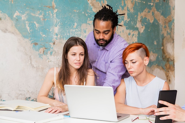 Young people working in the grunge office