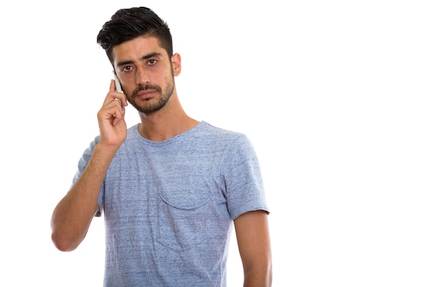 young Persian man talking on mobile phone