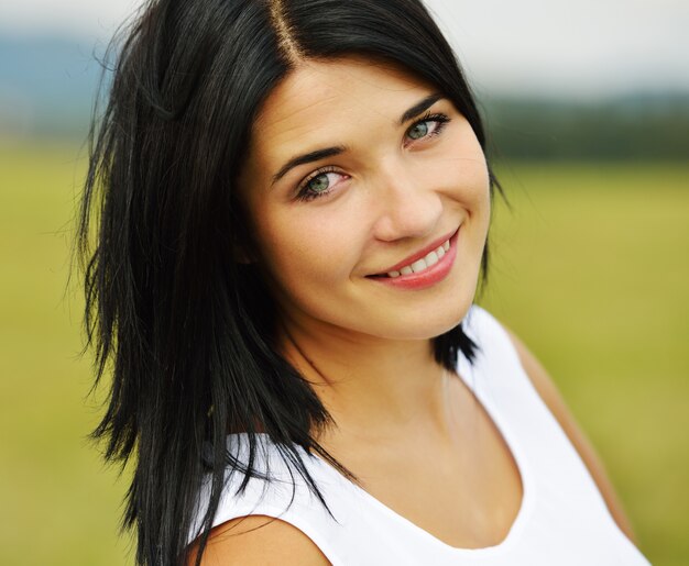 Young person having relaxed happy time on meadow in nature