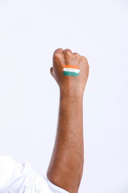 Young person painted indian national tricolor flag on hand