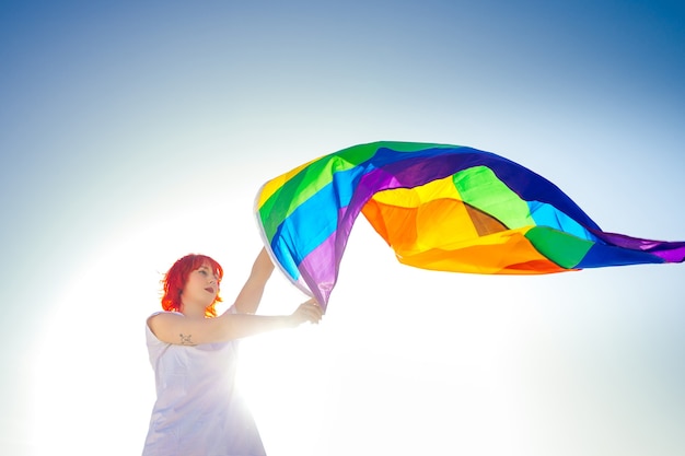 Young person with a LGBT pride flag