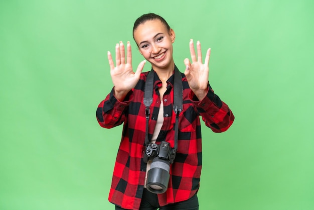 Young photographer Arab woman over isolated background counting eight with fingers