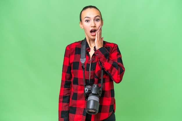 Young photographer Arab woman over isolated background with surprise and shocked facial expression