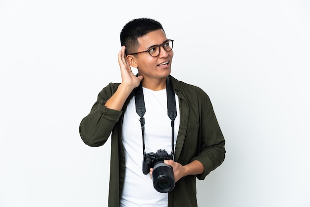 Young  photographer over isolated background