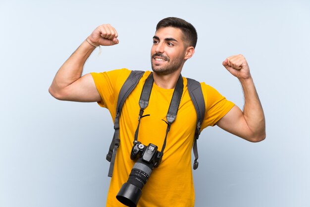 Young photographer man celebrating a victory