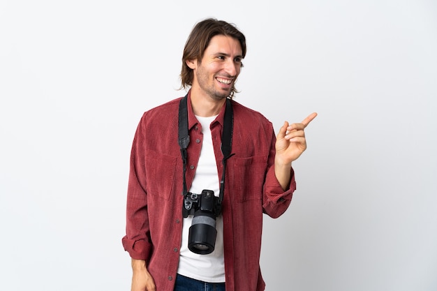 Young photographer man isolated on white background intending to realizes the solution while lifting a finger up