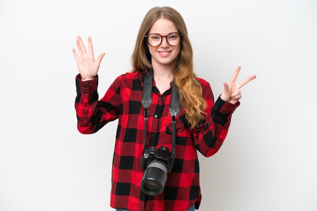 Young photographer pretty woman isolated on white background counting eight with fingers