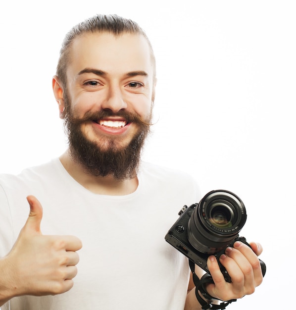 Young photographer with digital camera.