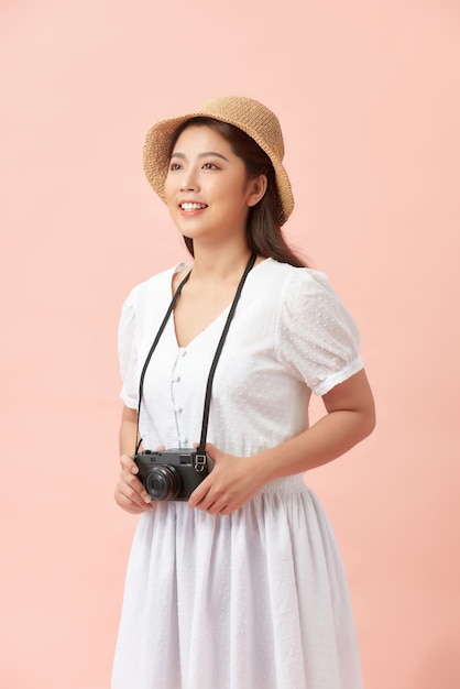 Young photographer with vintage camera.