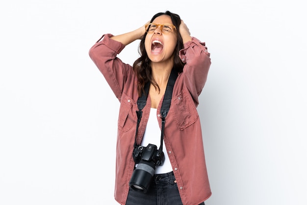 Young photographer woman over isolated white stressed overwhelmed