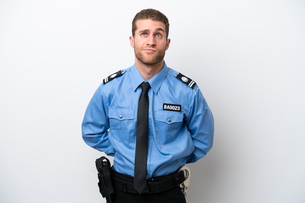 Young police caucasian man isolated on white background and looking up