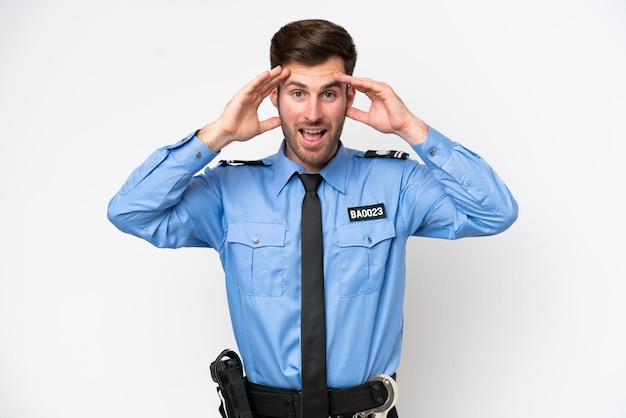 Young police caucasian man isolated on white background with surprise expression