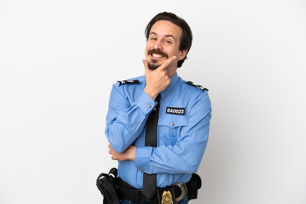 Young police man over isolated background white smiling