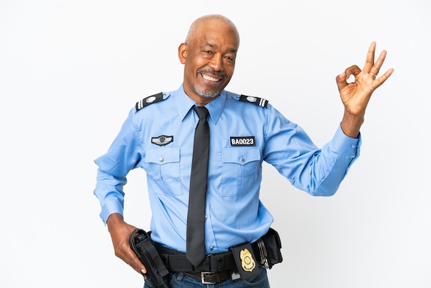 Young police man isolated on white background showing ok sign with fingers