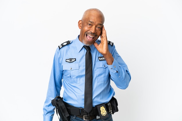 Young police man isolated on white wall with surprise and shocked facial expression