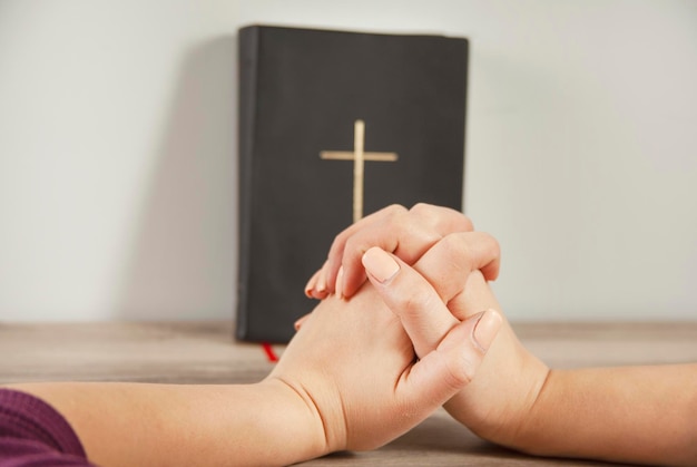 Young prayer woman holding Bible