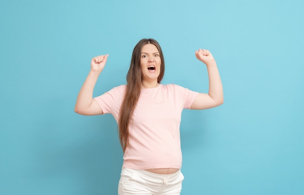 Young pregnant woman in casual clothing