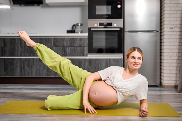 Young pregnant woman posing