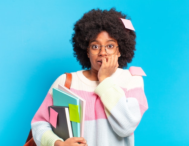 Young pretty afro student woman