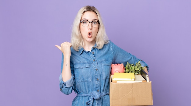 Young pretty albino woman looking astonished in disbelief. dismissal concept