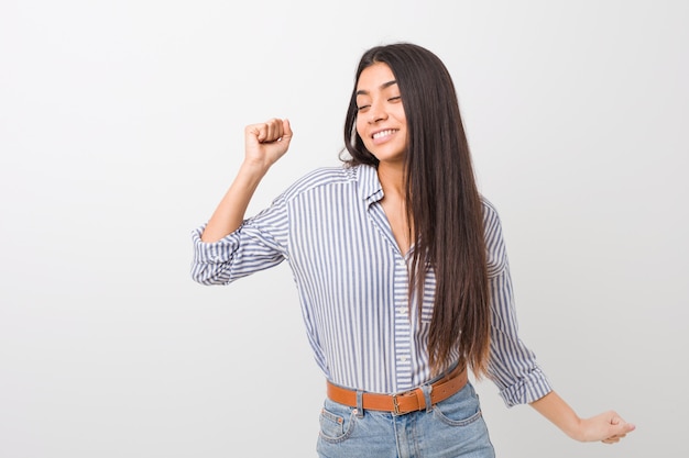 Young pretty arab woman dancing and having fun.