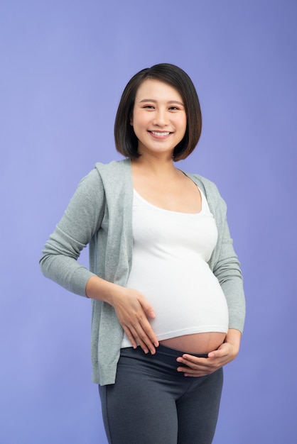 Young pretty Asian pregnant woman